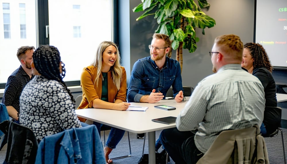 Customer service professionals collaborating at a CS Hub event